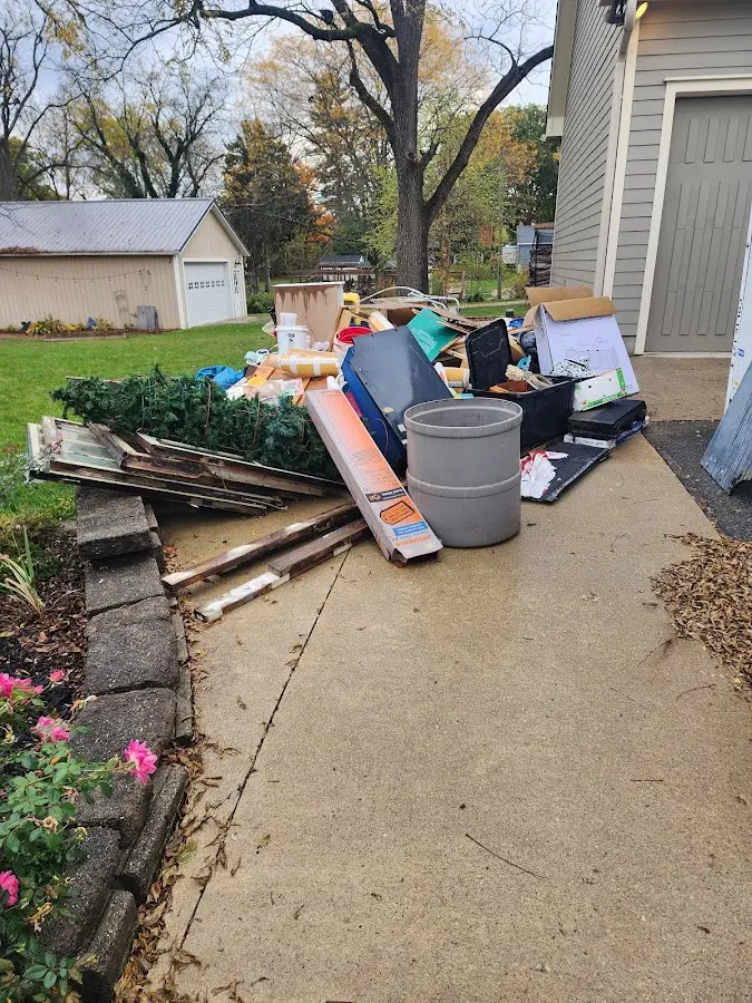 Dumpster being loaded with debris for Roofing Dumpster Rental in Welby